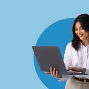 a woman holding a laptop