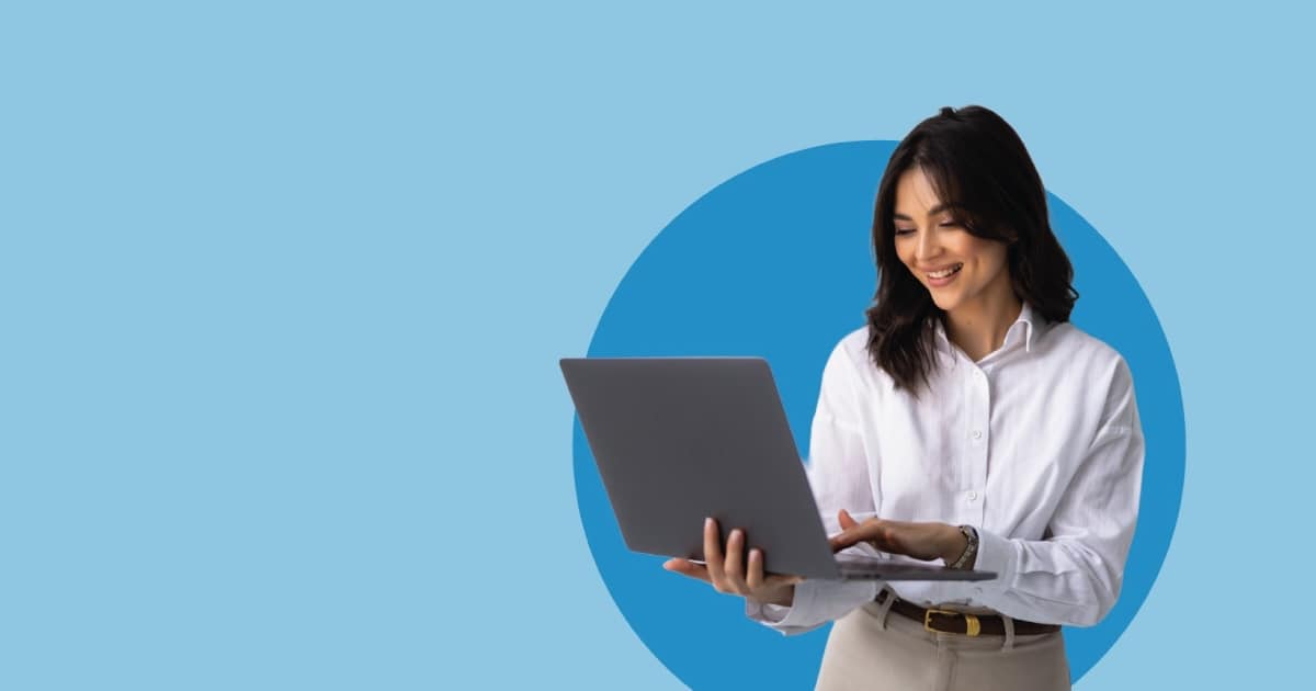 a woman holding a laptop